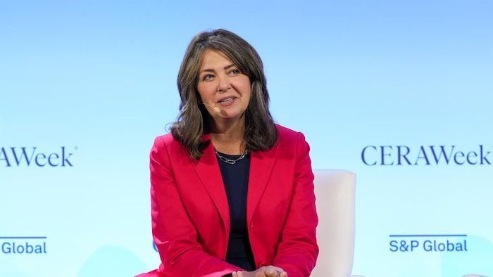 Danielle Smith speaks on the stage of Ceraweek on March 12, 2025 in Houston. She has her hands joined.