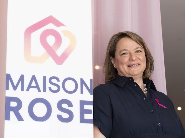 Karine-Iiseult Ippersiel poses next to the poster of the new Rose house.