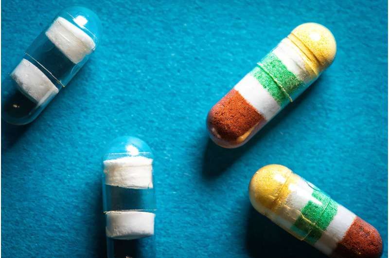 The drugs in the capsules are separated by polymer barriers sensitive to pH (white) which can be set to release each medication or dose at different times. This photo presents capsules without medication (left) and those filled with drugs (right). Credit: David Baillot / UC San Diego Jacobs School of Engineering A timed release capsule could replace the socket of several pills