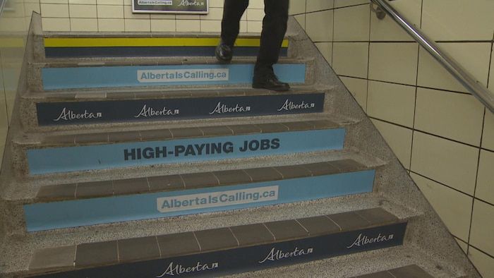 Alberta government posters stuck on the metro steps.