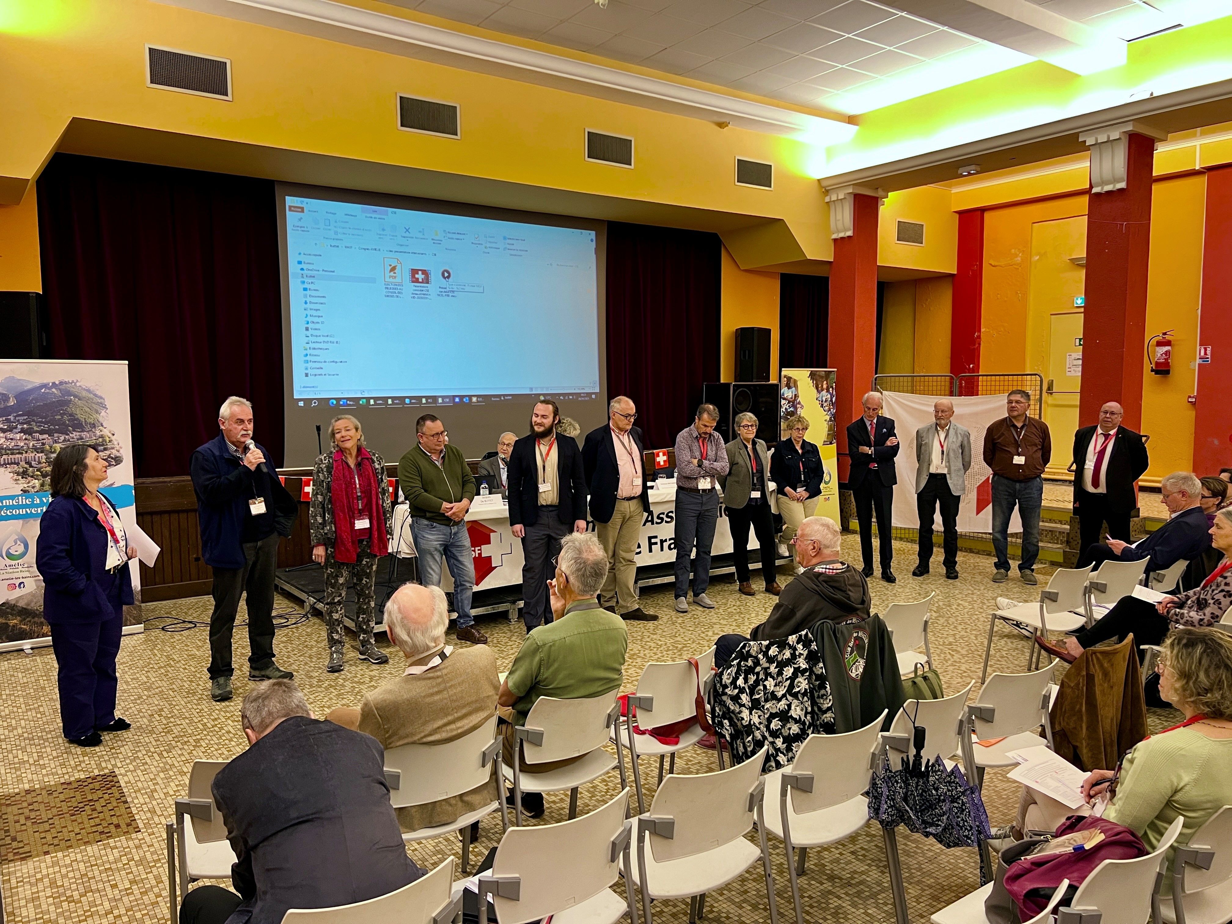 Standing aligned people appear at an assembly