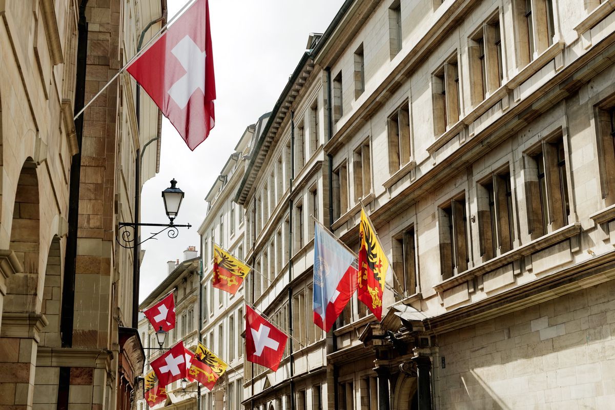 Rue de l'Hotel de Ville in Geneva, showing Swiss and Geneva flags on May 24, 2024. Rue de l'Hotel de Ville in Geneva, showing Swiss and Geneva flags on May 24, 2024.