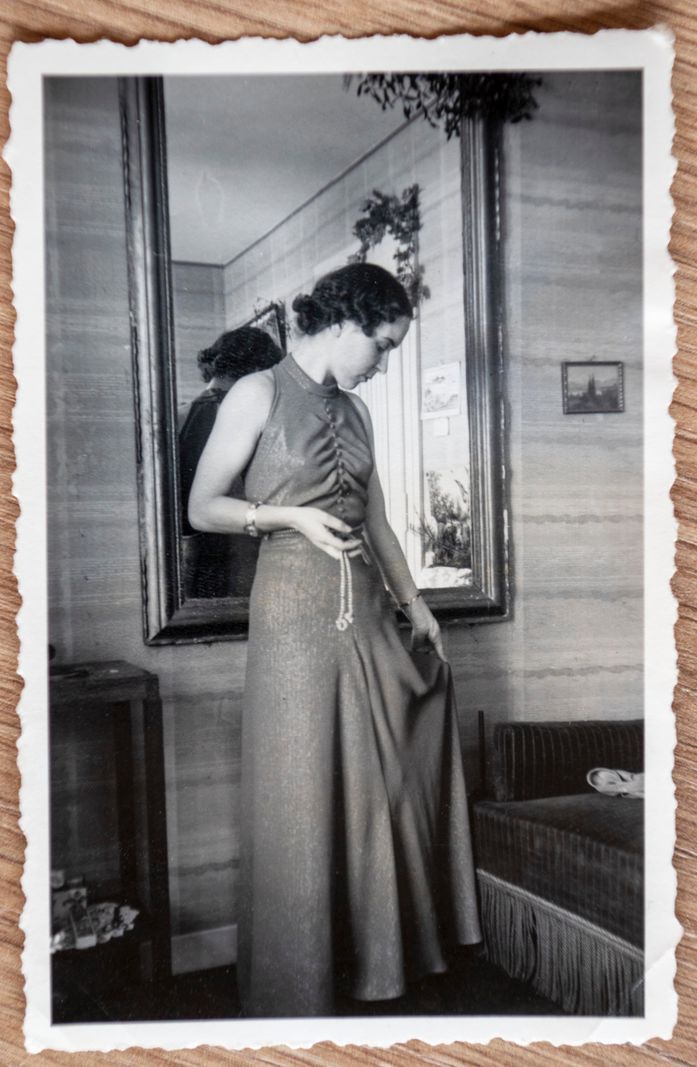 Francine Grandjean in a ball gown at the age of 24 in 1939, standing in front of a mirror at the Agapê home. Francine Grandjean in a ball gown at the age of 24 in 1939, standing in front of a mirror at the Agapê home.
