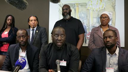 The family of Aboubakar Cissé, during a press conference in the National Assembly, April 29, 2025. (Thomas Samson / AFP)