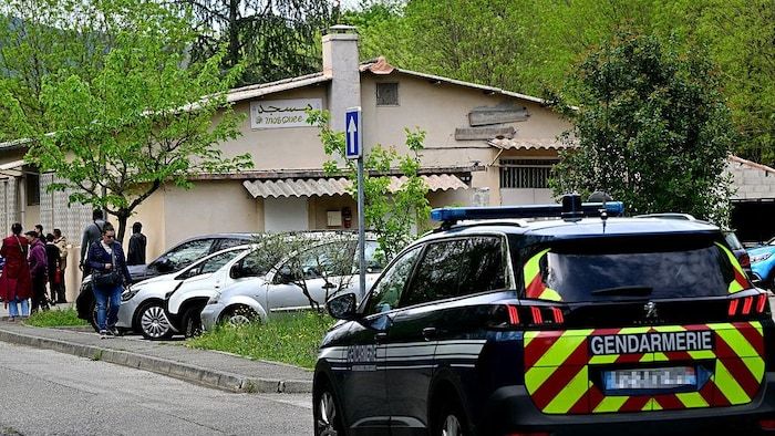 A car from the French gendarmerie patrolled in front of a mosque.
