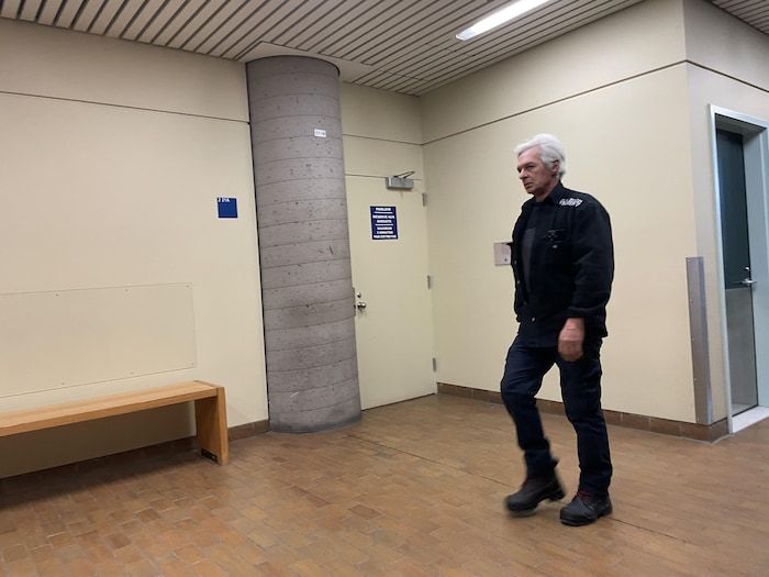 A man walks at the Quebec Palace of Justice.