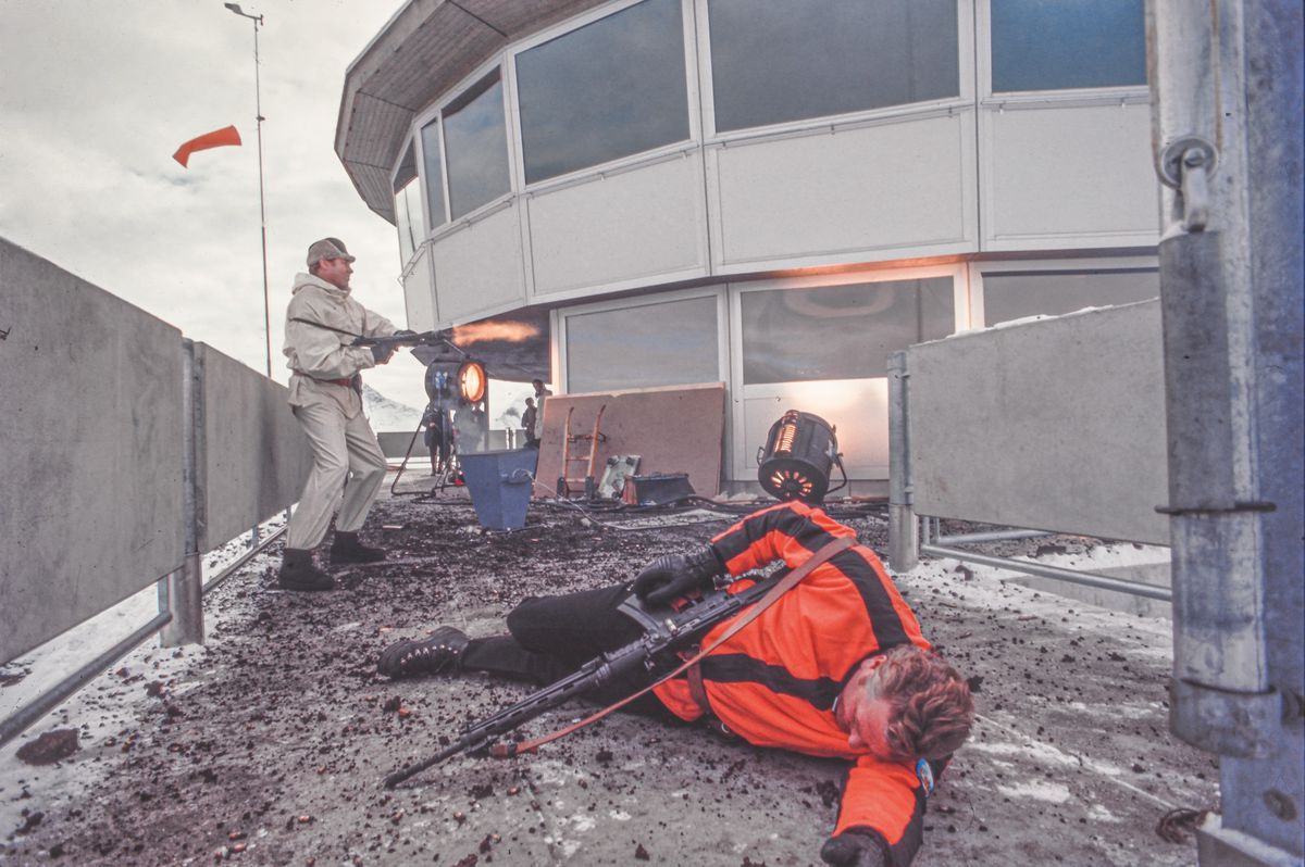 Scene of the film showing an explosive confrontation at Piz Gloria, with a white character pulling on the enemy on the ground. Scene of the film showing an explosive confrontation at Piz Gloria, with a white character pulling on the enemy on the ground.