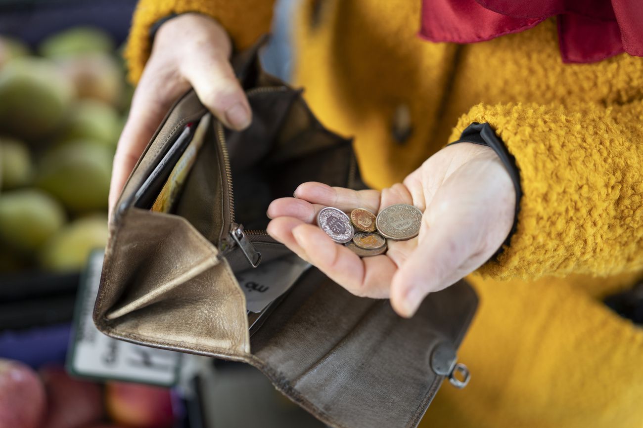 Hand coming out of the parts of a wallet
