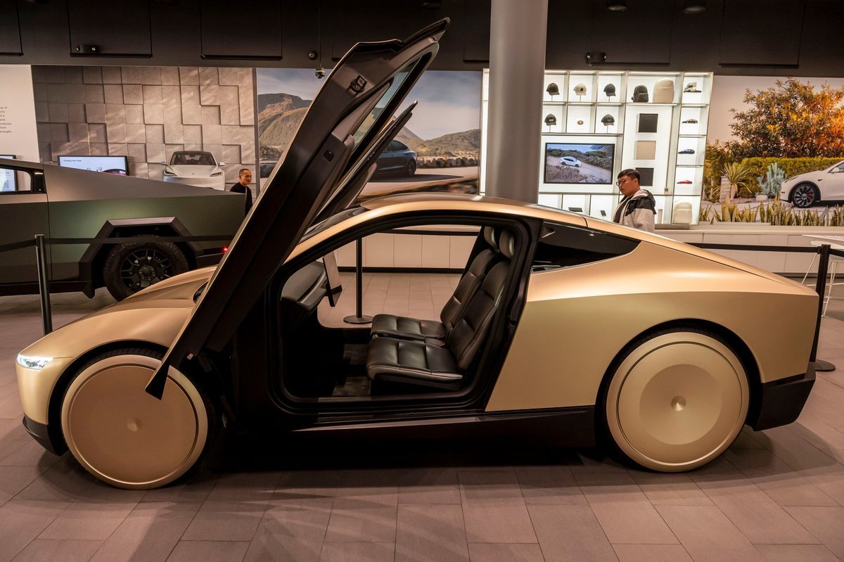 Prototype of Tesla Cybercab exhibited in a Tesla store in San Jose, California, on November 12, 2024. The vehicle, without steering wheel or pedals, will probably be produced in 2026. Prototype of Tesla Cybercab exhibited in a Tesla store in San Jose, California, on November 12, 2024. The vehicle, without steering wheel or pedals, will probably be produced in 2026.