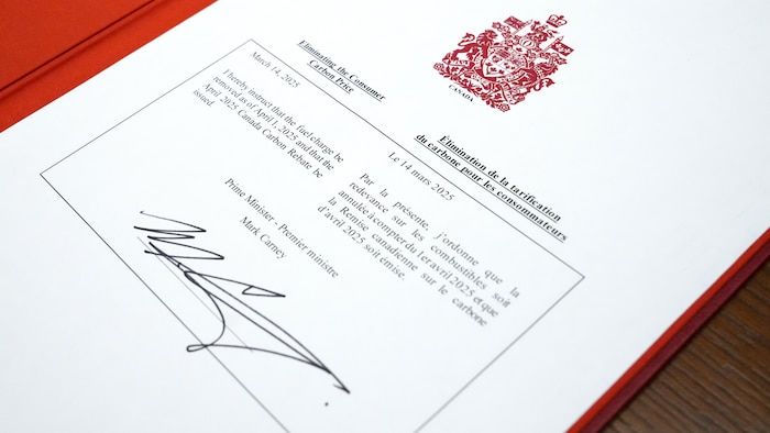 Mark Carney's signature on a document that formalizes the measure.