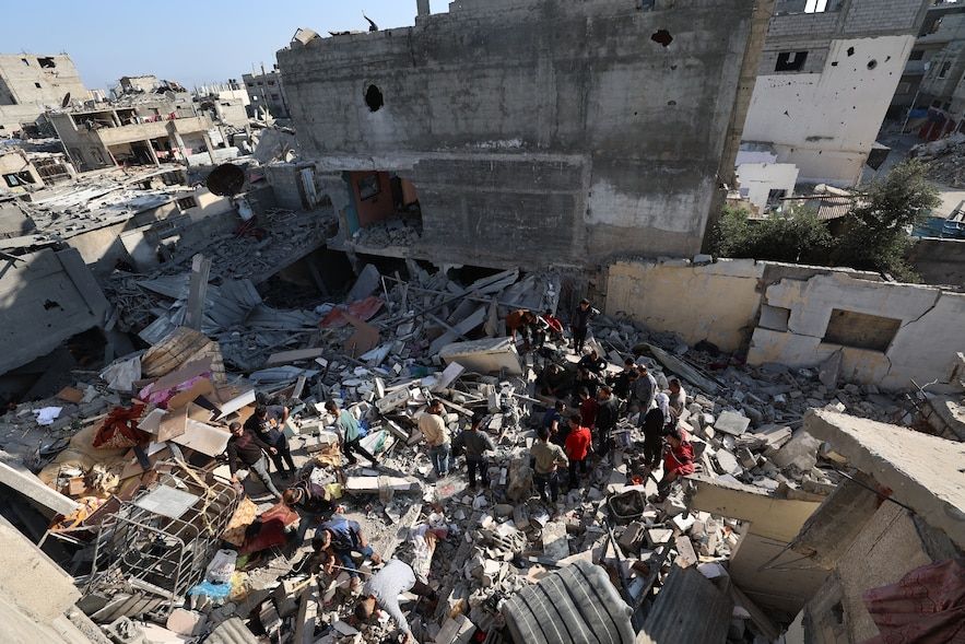 Palestinians are looking for survivors in the rubble of a building affected by an Israeli shot in Bureij, in the center of the Gaza Strip, May 2, 2025