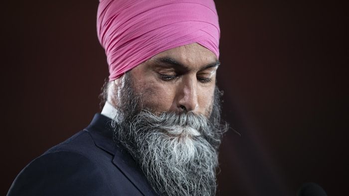 Jagmeet Singh is visibly disappointed and lowers his gaze after his stinging defeat.