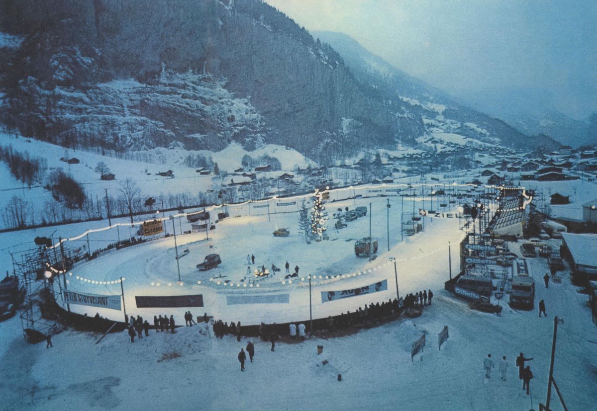 A temporary snowy stadium between Lauterbrunnen and Stechelberg for a Autorennn, with cars and spectators. A temporary snowy stadium between Lauterbrunnen and Stechelberg for a Autorennn, with cars and spectators.
