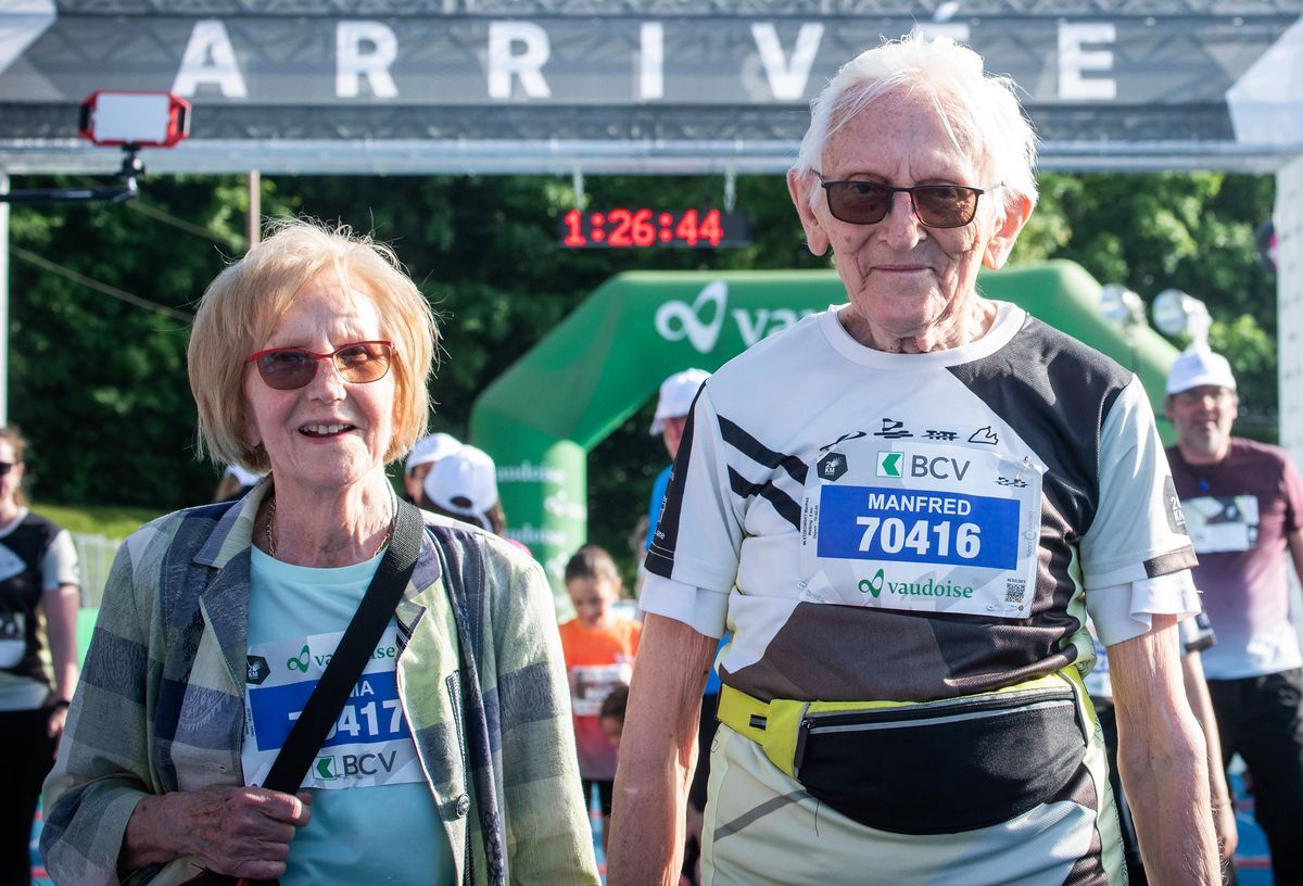 Emma and Manfred Mletzkowski, 90 and 91 years old, participants at the 20 km of Lausanne, under the arrival arch, visible bib number. Emma and Manfred Mletzkowski, 90 and 91 years old, participants at the 20 km of Lausanne, under the arrival arch, visible bib number.