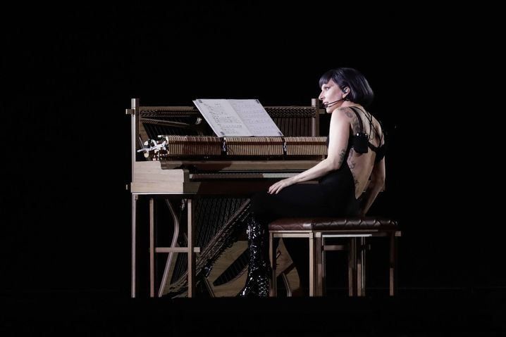 At the end of the concert, the singer moved to the piano to sing