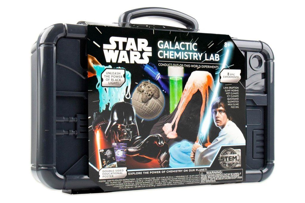 Mark Hamill in a chemistry lab with a black case and box with a black cover