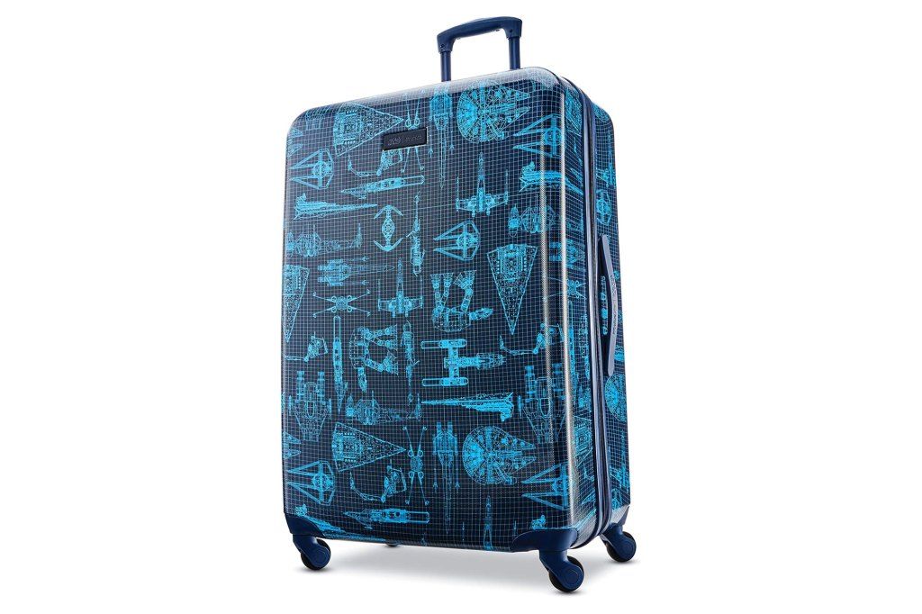 A blue suitcase with a pattern on it